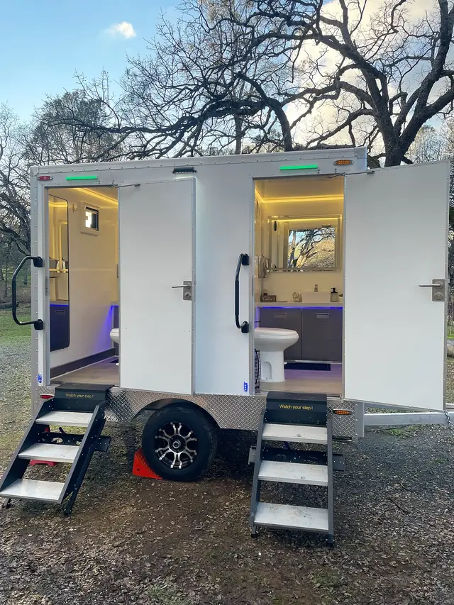 Lit restroom trailer stalls